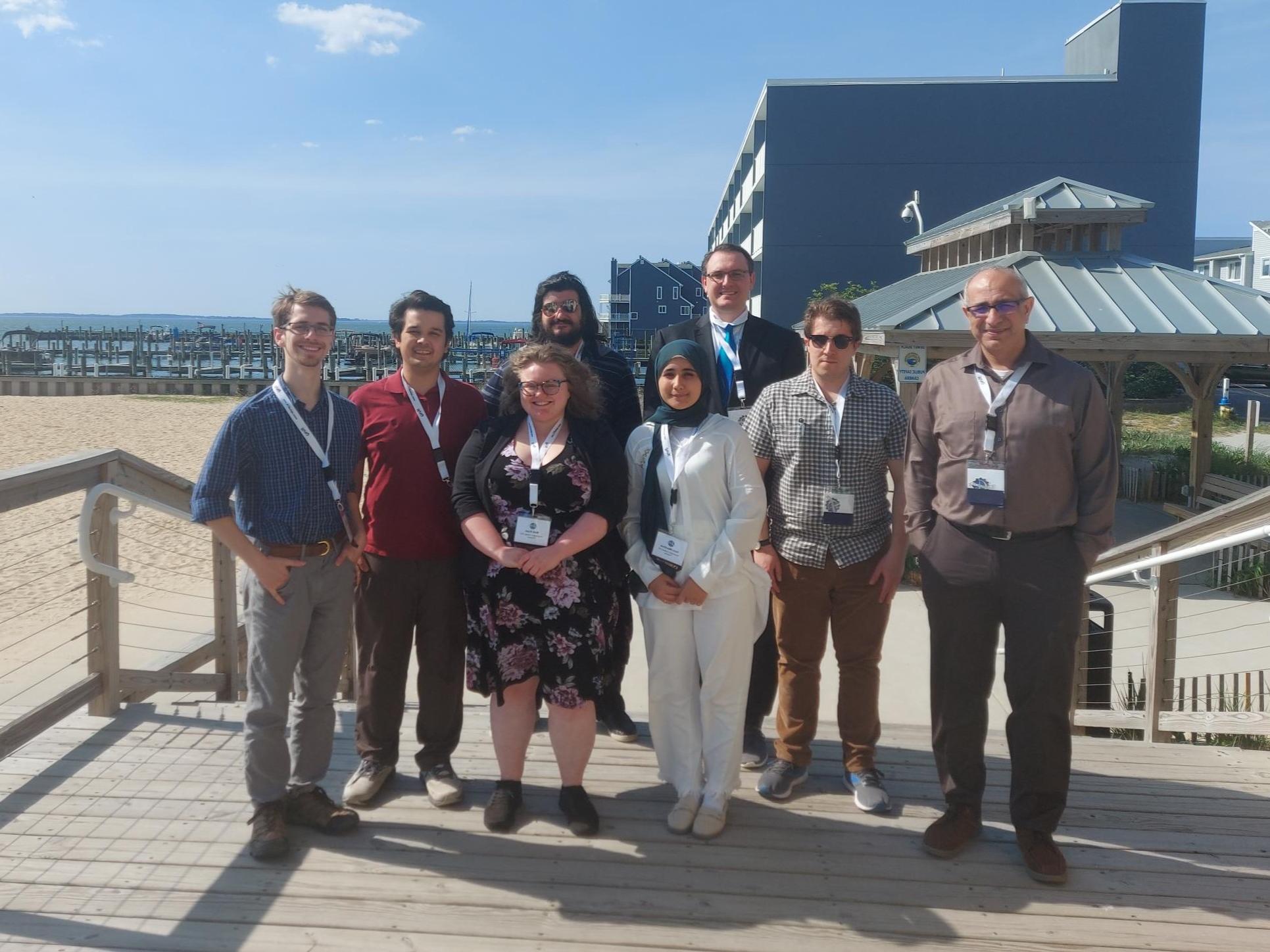 Group photo of the GIS staff near the beach